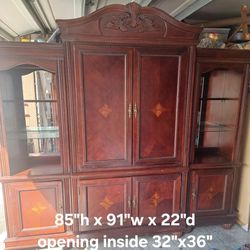Armoire/entertainment center with Lighted side cabinets