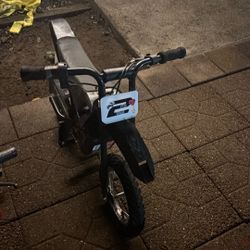Tiny electric motorcycle dirtbike for five and eight-year-old boys and girls