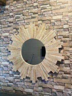 Restoration hardware wall mirror. Sun splash wooden frame . Measure 3 ft across .