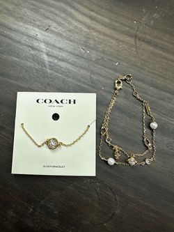 Coach gold bracelets