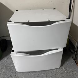 Two Whirlpool washer & dryer pedestals  include storage drawer for laundry supplies good condition