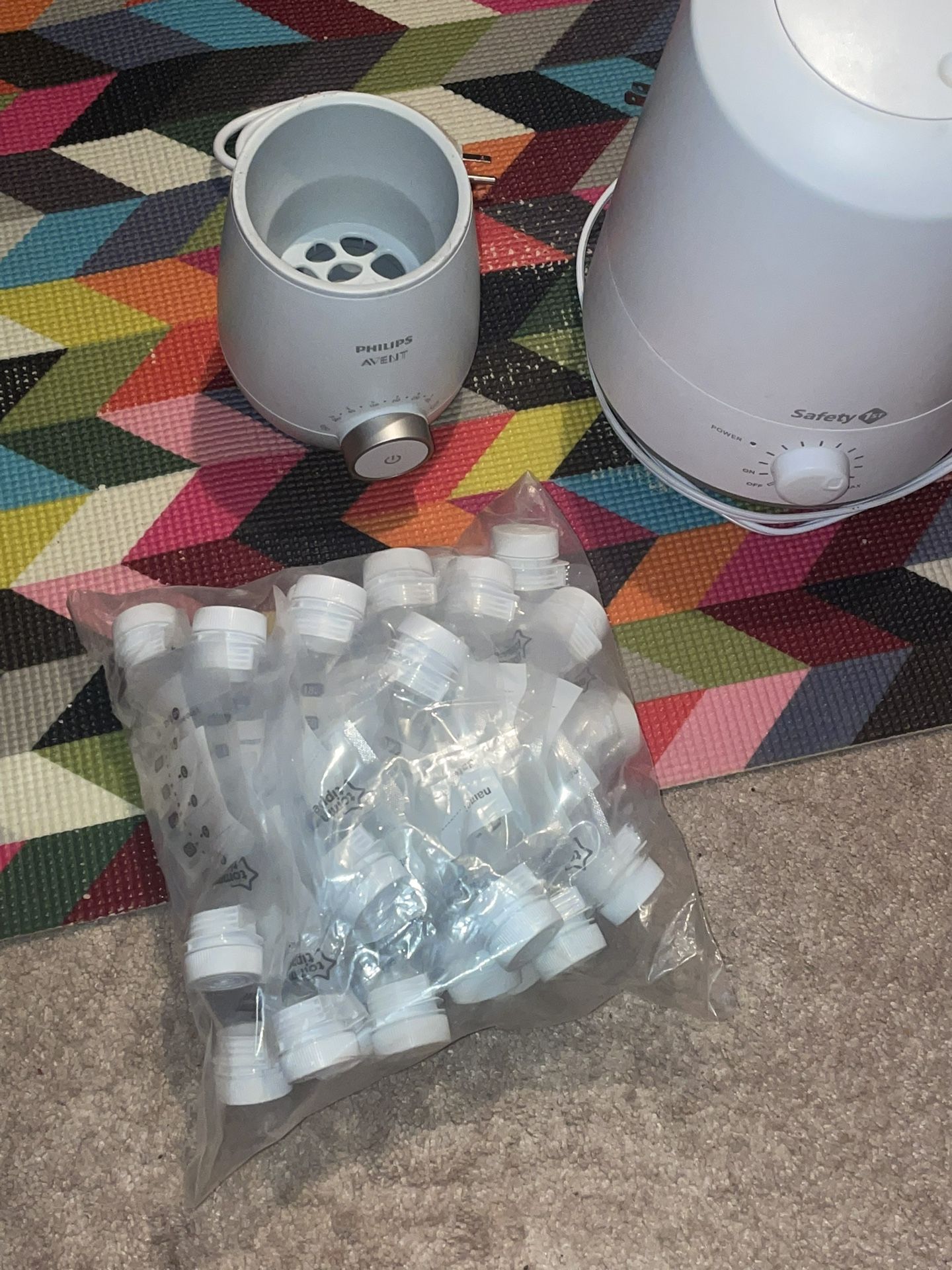 A Baby Bottle, Warmer,A Baby Humidifier And Breast Milk Storage Bags