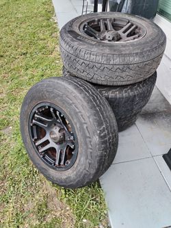 Set of 4 Tires on Black Alloy Wheels