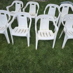 Eight plastic chairs