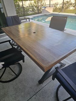 $500 ORO All heavy Metal patio farmtable with 4 swivel chairs better homes and garden