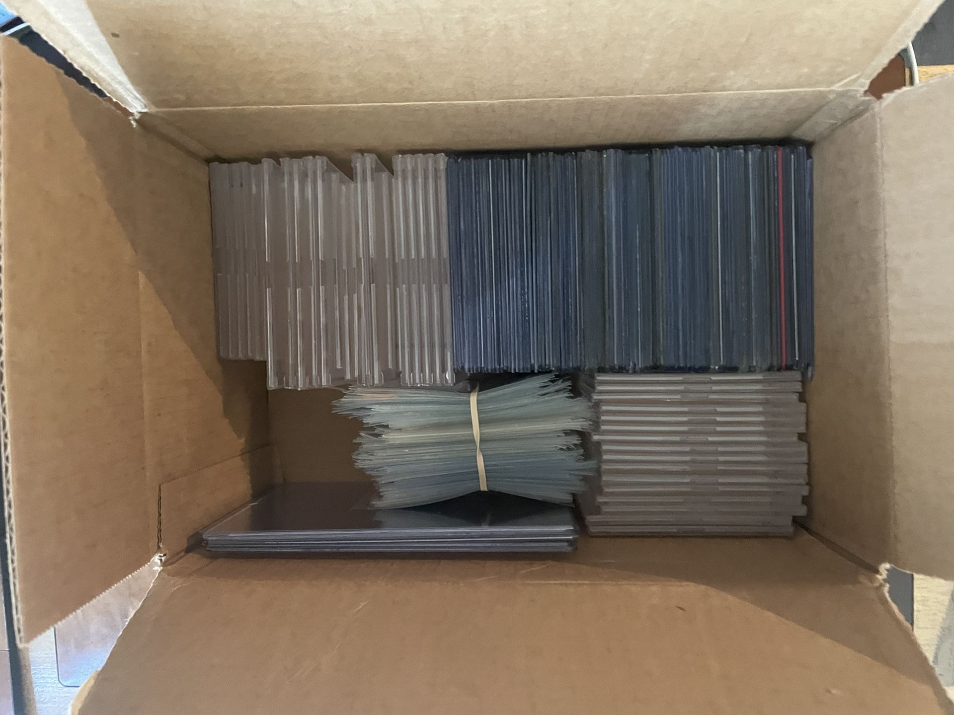 Hundreds Of Used Toploaders, Cases and Penny Sleeves 