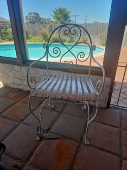 Ornate metal chair rust