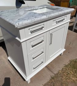 36" WHITE BATHROOM VANITY DAMAGE ON BACK