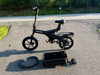 Ebike for sale with bike tire tube, charger, and basket.