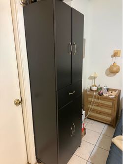 Black storage cabinet with draw
