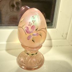 Vintage Fenton Art Glass pink opalescent egg, featuring hand-painted floral details. 
