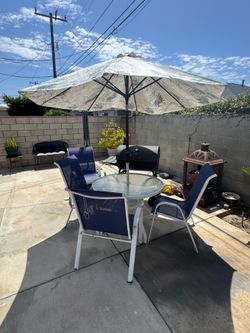 Patio set with barbecue pit
