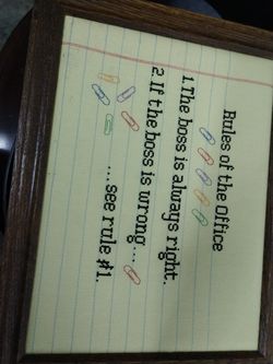 Hand stiched picture of office rules