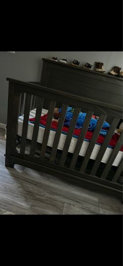 The baby crib has been lightly used. It has no scratches, comes with a mattress included, and includes two sheets.