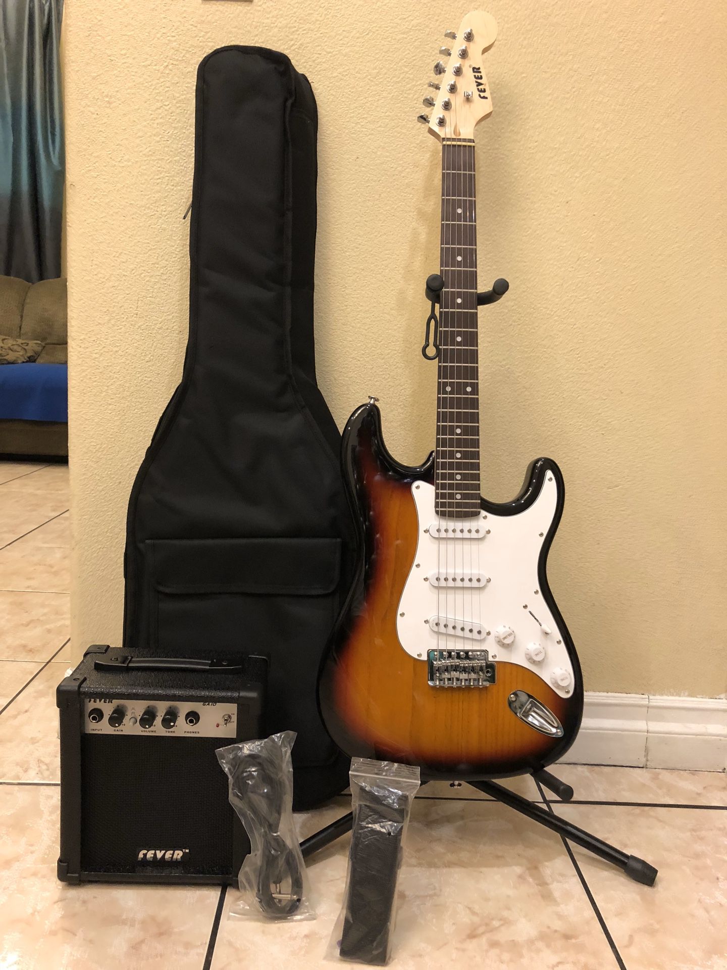 Fever electric guitar with case cable strap and amp