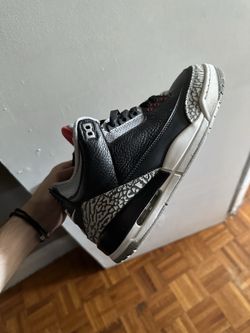 Size 9.5 black cement 3s