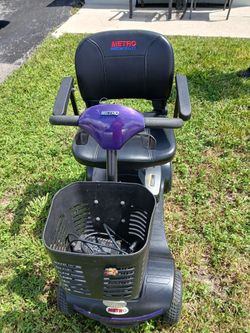 METRO MOBILITY PURPLE 4 WHEEL SCOOTER