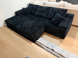 Black Corduroy Sectional Sofa with Ottoman and Black Rug