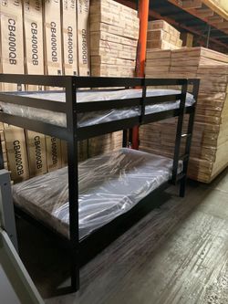 Twin bunk bed. Available in espresso. Bunk bed only-$220. With mattresses-$399. Assembly required. Assembly not included. Tax included. Free delivery.