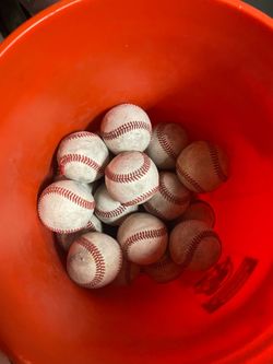 Tons of baseballs and baseball equipment