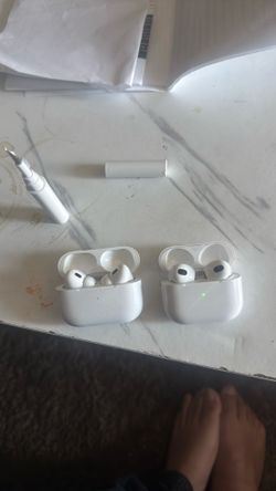 2 AirPods with AirPod cleaner