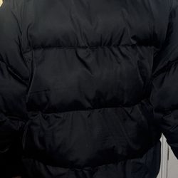 Black Nike Puffer Tag Says S fits Like A L