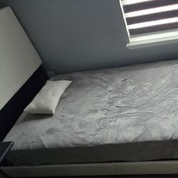 Twin bed frame with headboard and mattress