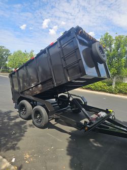 NEW DUMP TRAILER 12X8X4 12000 LBS
ROLLING TARP--SPARE TIRE,ELECTRIC BRAKES,HYDRAULIC SYSTEM,REMOTE CONTROL,IDEAL FOR HAULING, DEMOLITION, TRASH ETC,