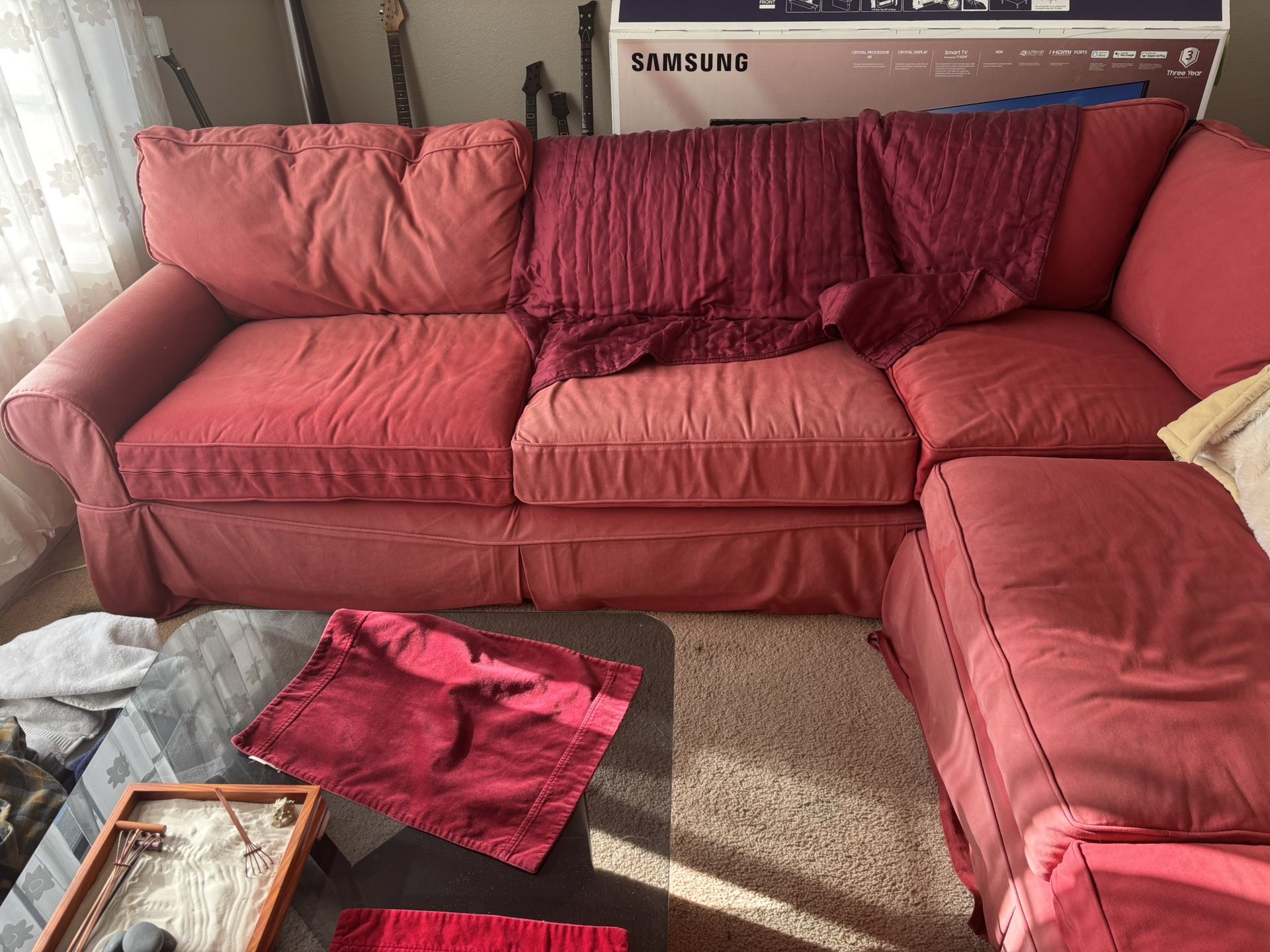 Large red sectional pull-out couch