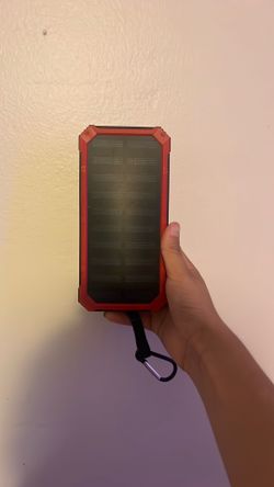 Solar power portable charger with flashlight