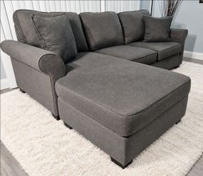 2-piece gray sectional sofa from Living Spaces. In excellent condition, thoroughly cleaned, and ready for use. Features double-sided, removable cushio