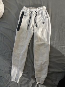 White Nike tech pants