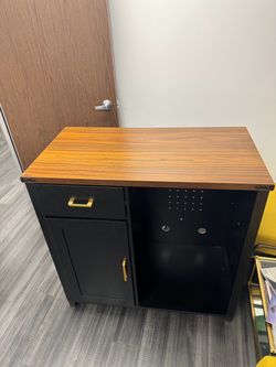 Black and Wood Storage Cabinet with Drawer with space for a refrigerator