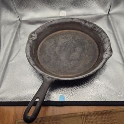 Two vintage, ten inch diameter cast iron skillets