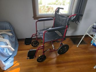 Red Transport Wheelchair with Footrests