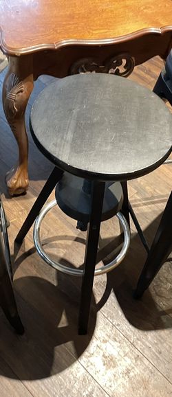 Small black with metal foot rest bar stool /
