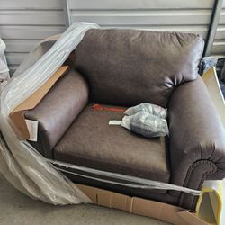 ASHLEY FURNITURE ROXMERE BROWN LEATHER CHAIR AND OTTOMAN