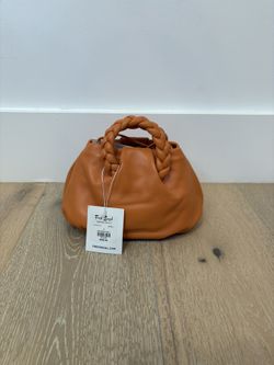 Hereu Bombon Supple Shiny Leather Shoulder Bag in an apricot or orange color,
