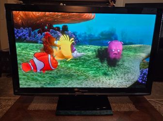 50" Panasonic Plasma TV with Stand, and  Original Remote Control