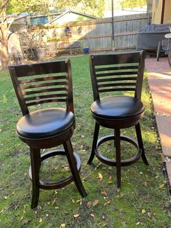 2 black faux leather swivels counter chairs