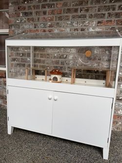 Hamster cage with storage cabinet (comes with accessories) hamster wheel, water dispenser and others