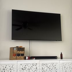 Samsung TV with sound bar and swivel mount