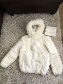 White rabbit coat from Alaska with matching purse