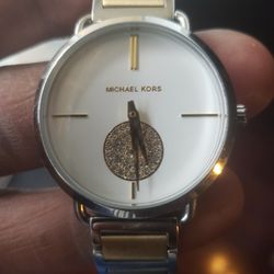 Women's silver and gold Michael Kors watch
