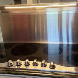 Viking stainless steel electric cooktop and Viking rear downdraft