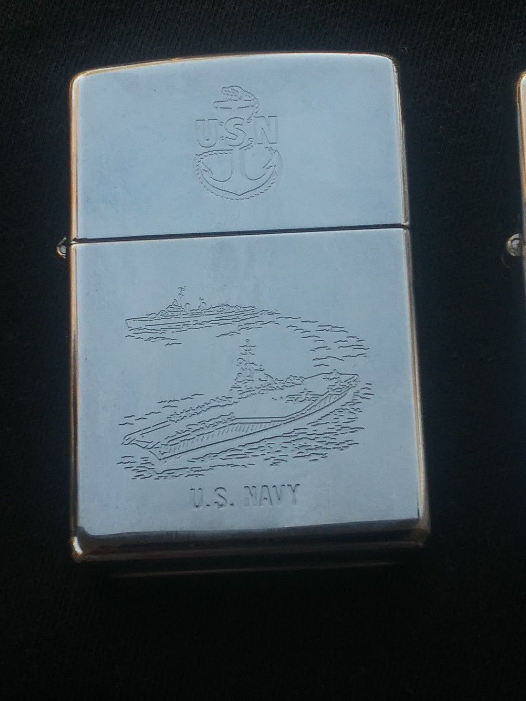 US navy Zippo sealed the other lighters are not reflective in this price they are other zippos and Park lighters