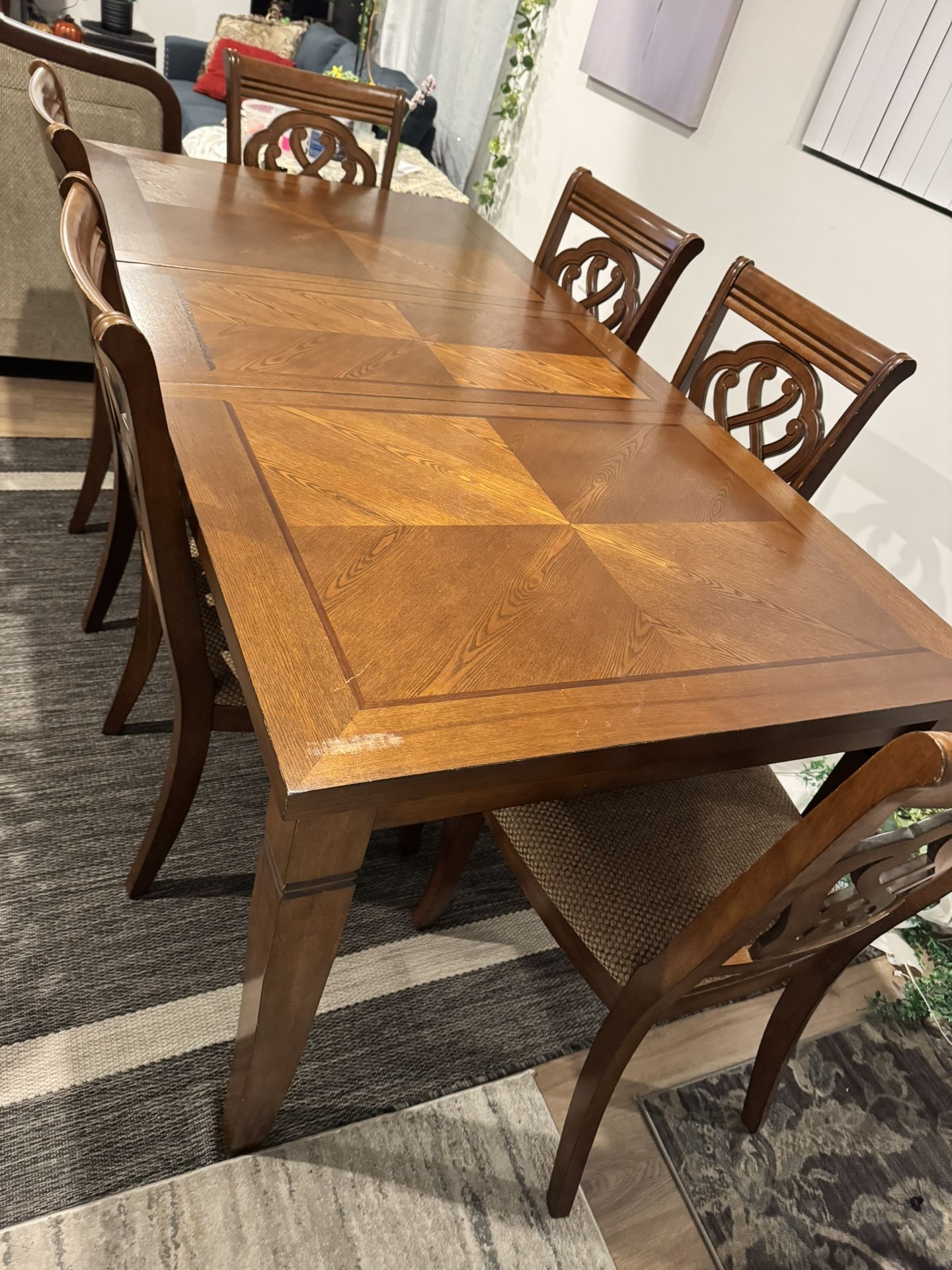 Wooden dining table with chairs