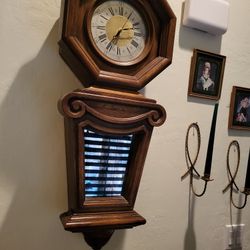 Clock  Antique wood smoke glass front battery, very heavy and large $150.Firm works great