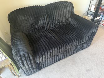 Black fuzzy corduroy love seat