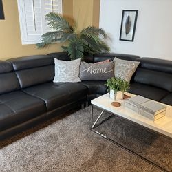Black sectional with coffee table